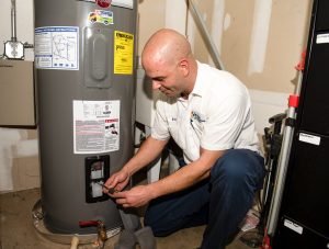 plumber repairing water heater