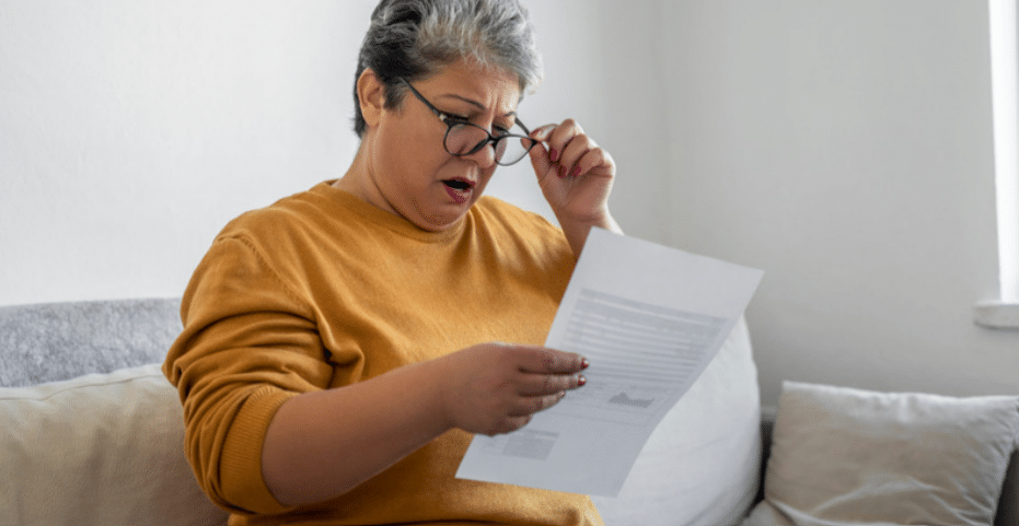 woman looking at her bill