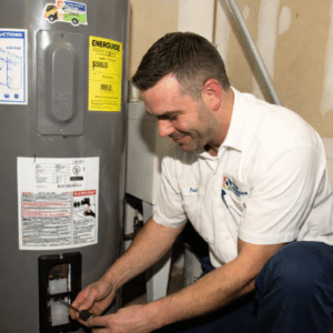 Four Seasons Plumbing professional plumber checking water heater in NC