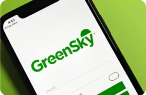 A smartphone screen displays the GreenSky app login page, featuring the GreenSky logo and user ID entry field, where users can access their financing plan and manage finance options.